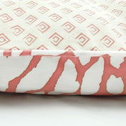 a batik pillow in the pattern coral bunga