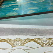 a photo of artisan doing batik in silkscreen technique