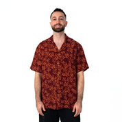 Front view of men's Cuban shirt in bold maroon coral batik.