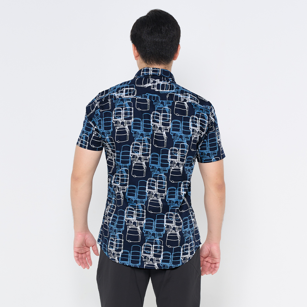 a male model showcasing the back of batik shirt in the pattern navy tiffin