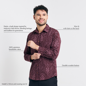Studio shot with text overlays highlighting features of the batik shirt
