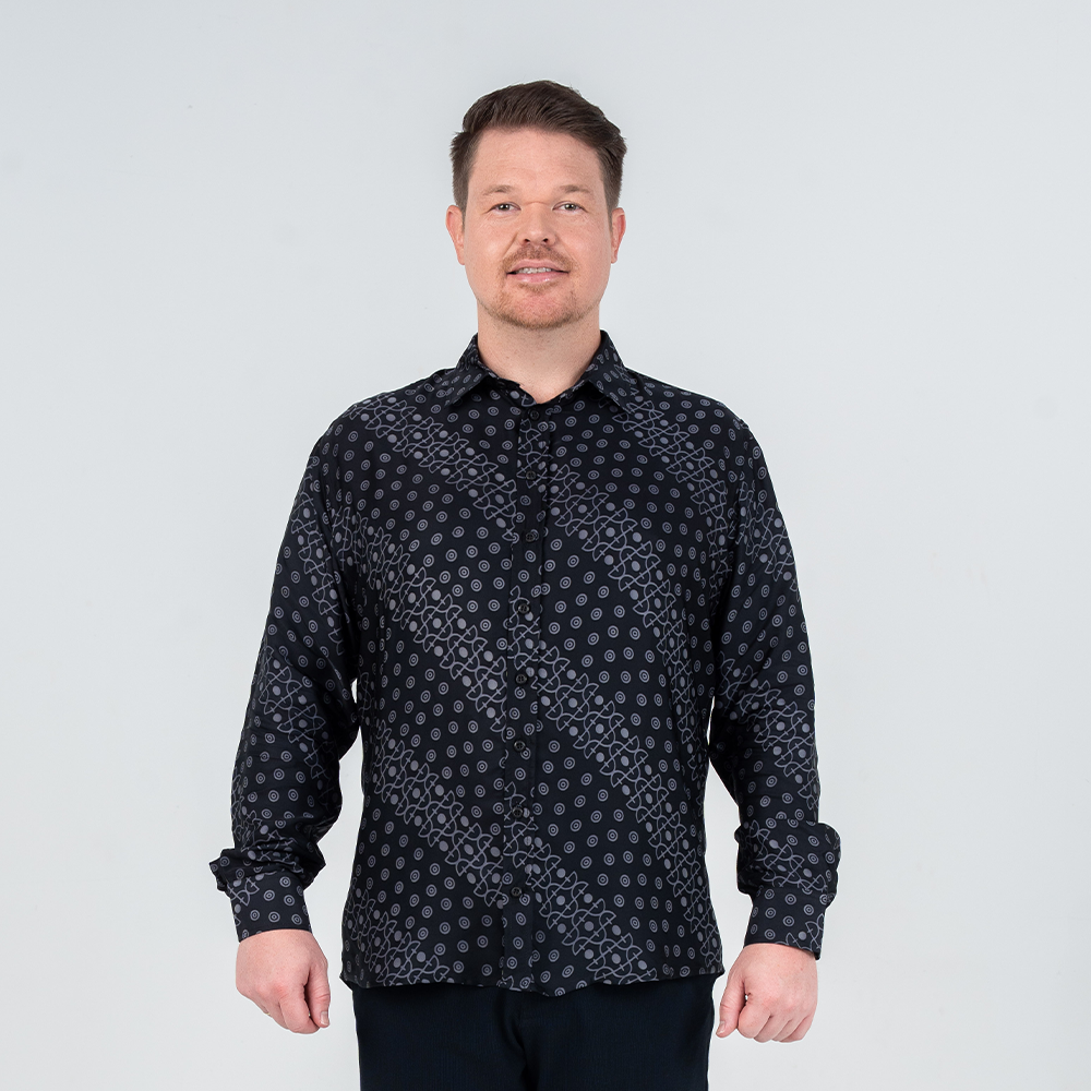 Front view of men's Jet Alur long-sleeved batik shirt featuring structured fit and wooden buttons.