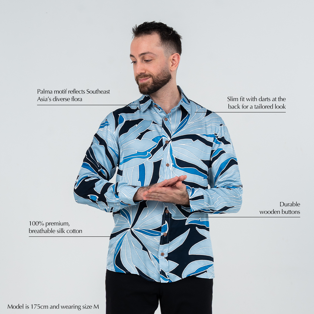 Key features of men’s Palma batik shirt: tropical flora motif, slim fit with darts, breathable silk cotton, and wooden buttons