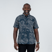 Front view of men's navy batik shirt featuring orchid motif, wooden buttons, and premium cotton fabric