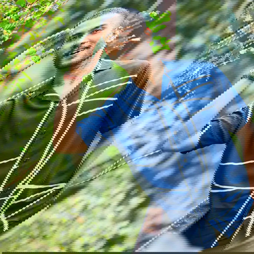 a men in cuban batik shirt in the pattern navy brush