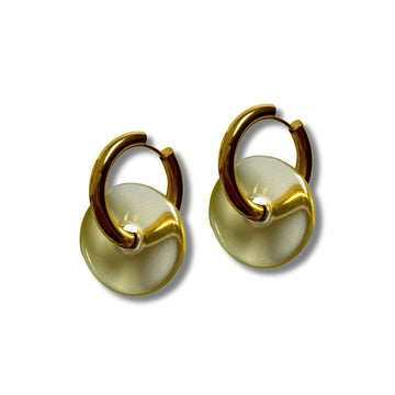 a photo of a hoop earrings made of gold against a neutral background