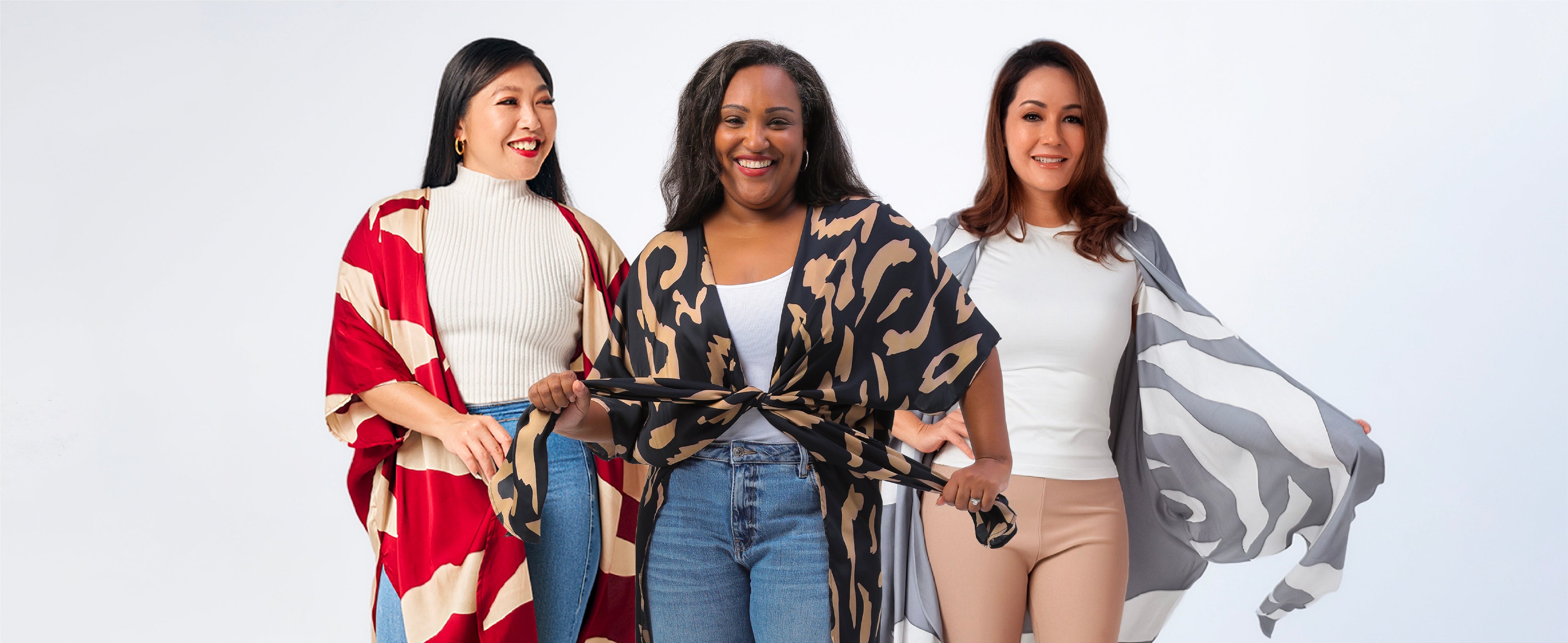 3 Women wearing batik kimonos in bright colors in Malaysian batik