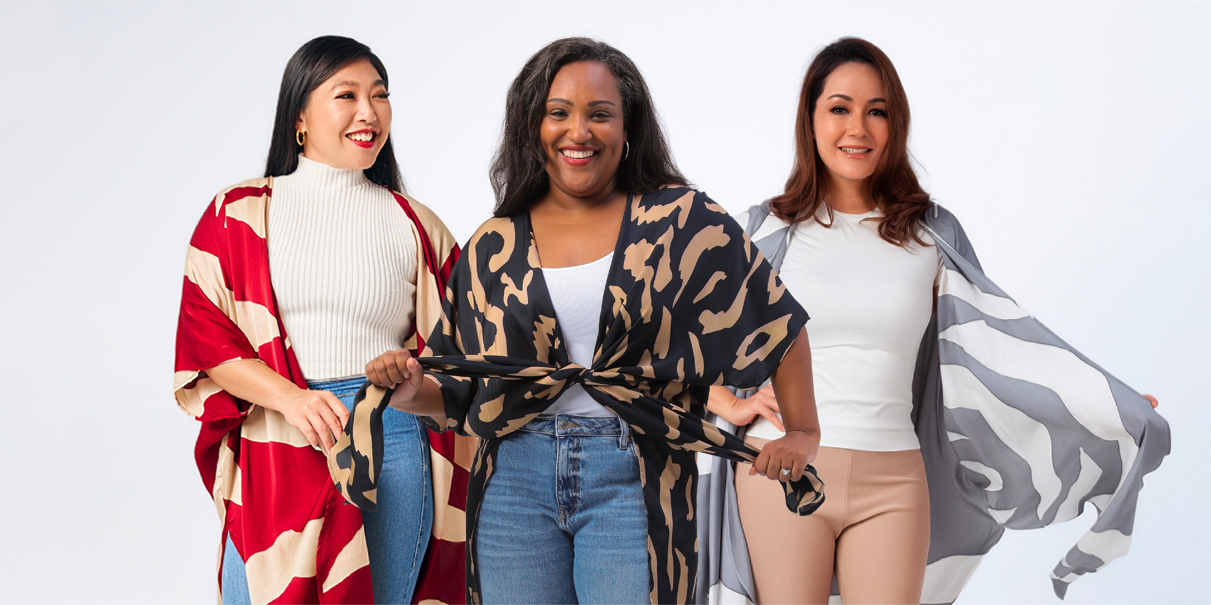 3 Women wearing batik kimonos in bright colors in Malaysian batik