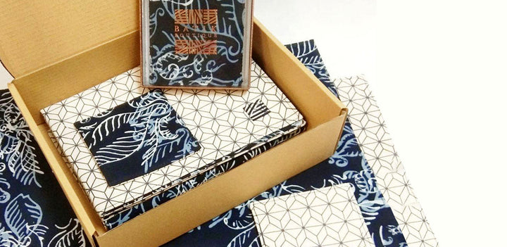 A batik pattern called Blue Nautical Fern in navy blue colour. Homeware set consists of placemats and coasters. 