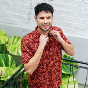 model wearing  Maroon Coral men's short sleeve shirt 