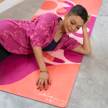 atilia haron on her yoga mat collection in the pattern fuchsia cat yogis