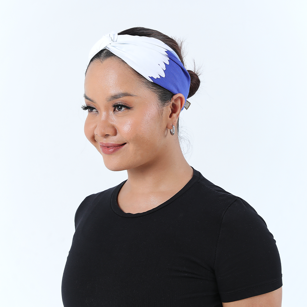 a female model posing in a batik headband in the pattern ice fur against a white background