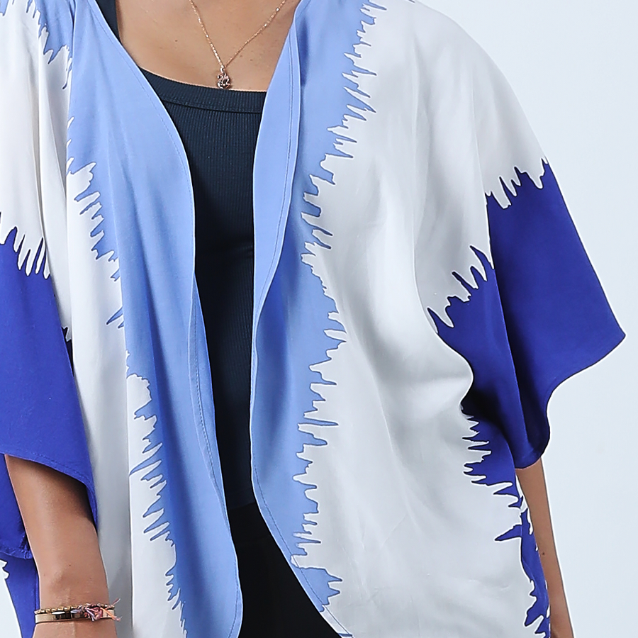 a closeup shot of a batik cardigan kimono in the pattern ice fur against a white background