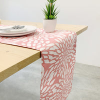Coral bunga table runner in a lifestyle photo