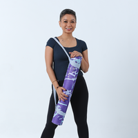 a model posing with a yoga mat periwinkle cat yogis