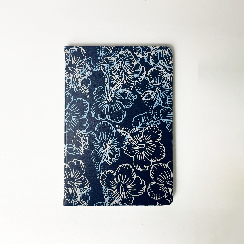 a batik inspired notebook in the classic pattern in navy hibiscus