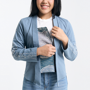 Batik Kebaya Jacket with Detachable Inner Lining – A model revealing the detachable lining, allowing the jacket to transform into a full kebaya