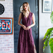 Batik Maxi dress in plum orchid show on a model in a lifestyle photo 