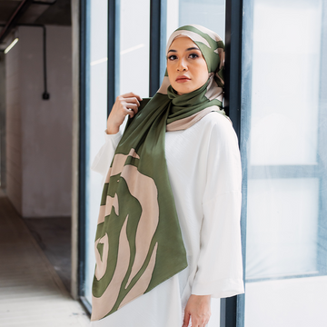 a female model posing with batik scarf as a hijab in the pattern olive rose