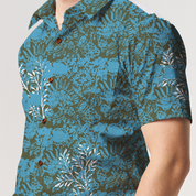 a closeup of batik shirt in the pattern cyan rumpai against a white background