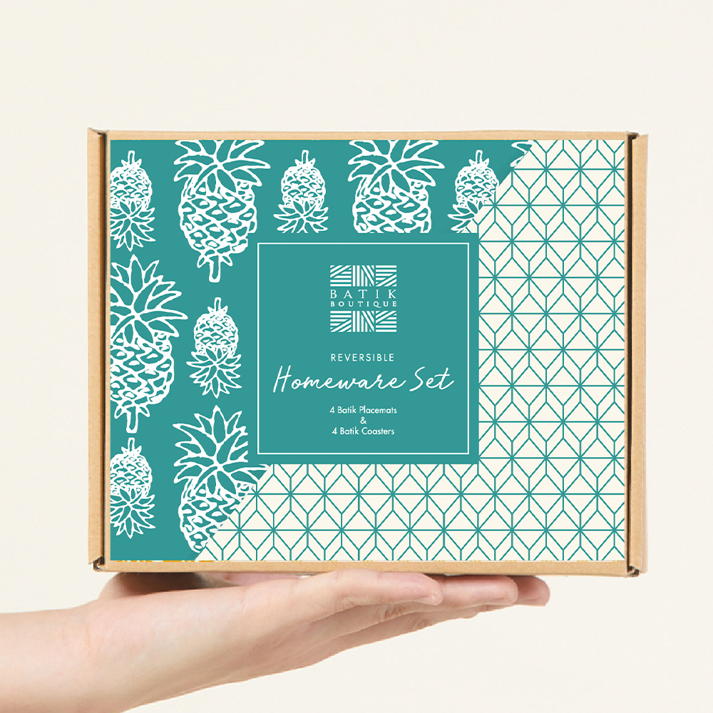 a white box photo of homeware set in a box in the pattern turquoise pineapple 