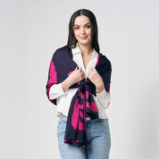 A model wearing an authentic batik scarf in the pattern fuchsia rose against a white background