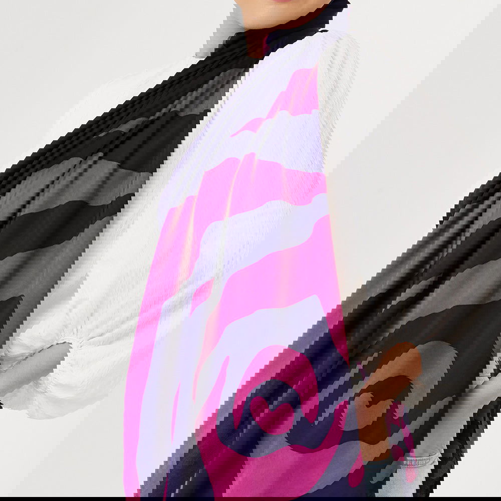 a close up of a batik scarf in the pattern fuchsia rose against a white background