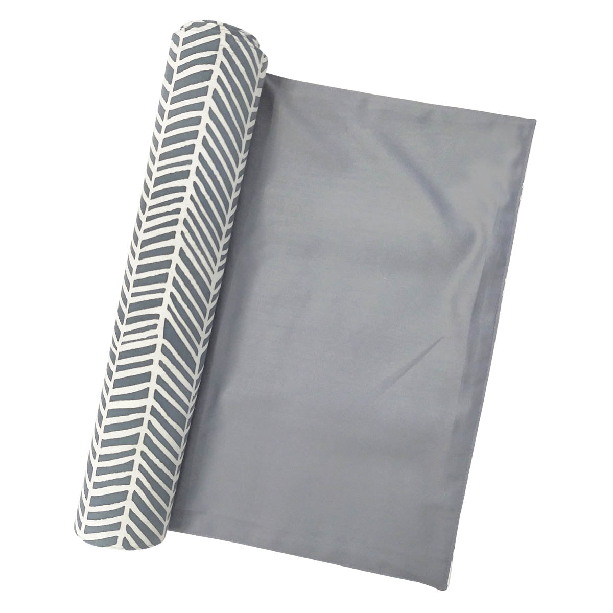 a batik table runner on a white background in the pattern grey banana leaf rolled up