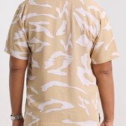 Zoomed in photo of the tan rimba shirt showing the detail of the shirt 