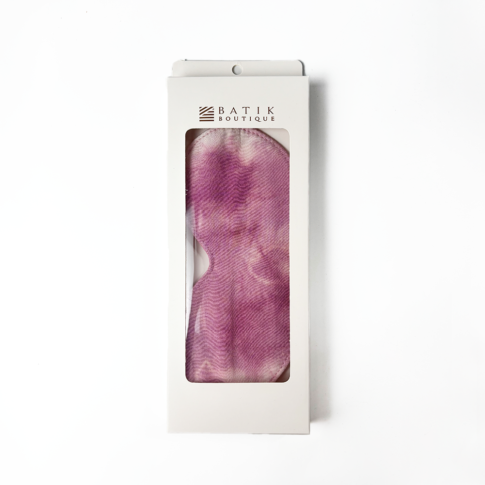 Plum Shibori eye mask by Batik Boutique packaged in white box with viewing window, featuring unique hand-dyed batik pattern.