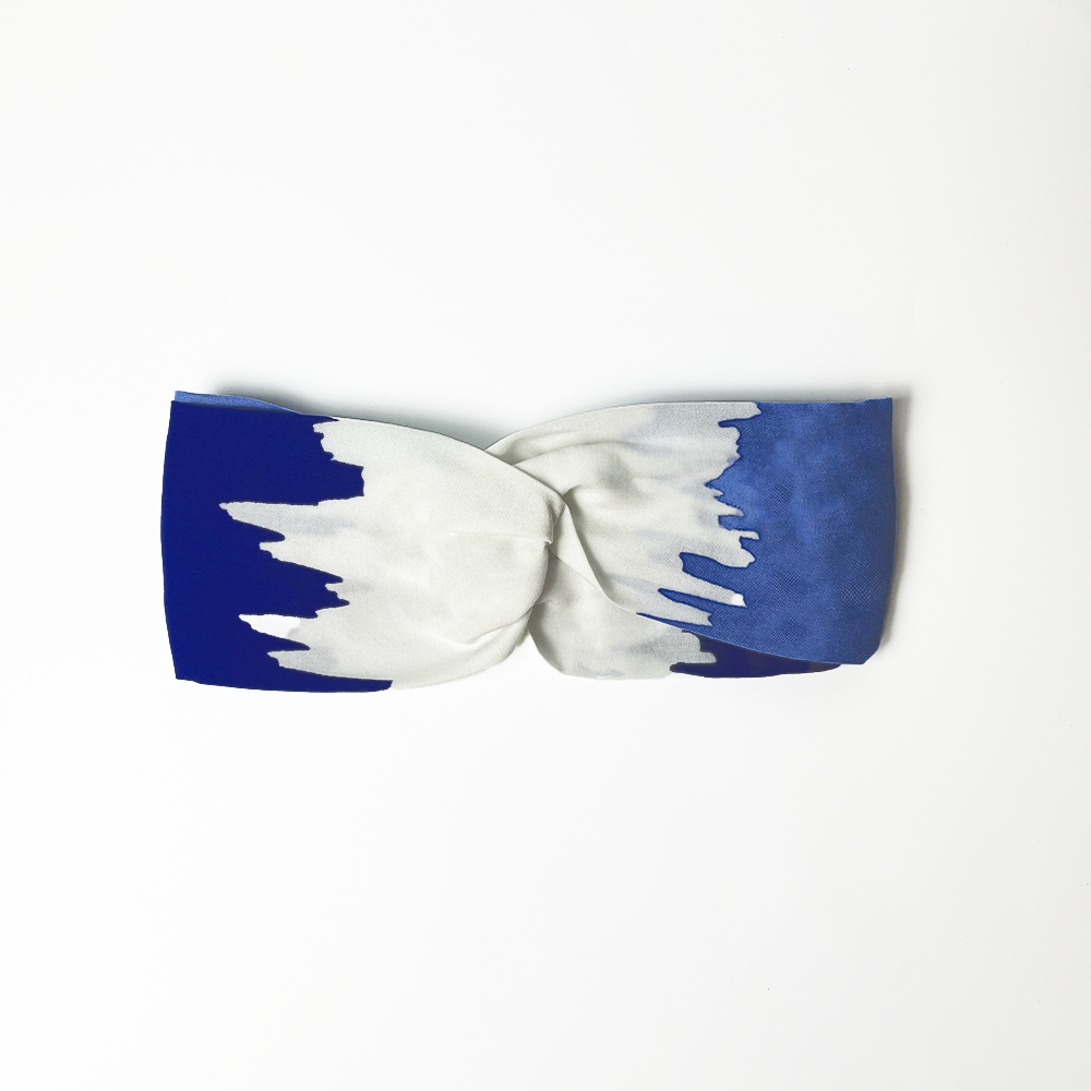 a headband white box photo against a white background of batik headband in the pattern ice fur