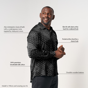 Product detail highlighting the unique selling points of the Black Alur batik shirt, including the contemporary twist on traditional batik, slim fit with darts at the back, durable wooden buttons, and breathable silk cotton fabric.