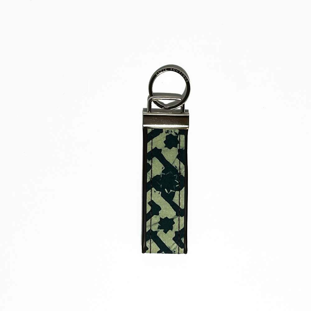 forest arabesque key fob against a white background