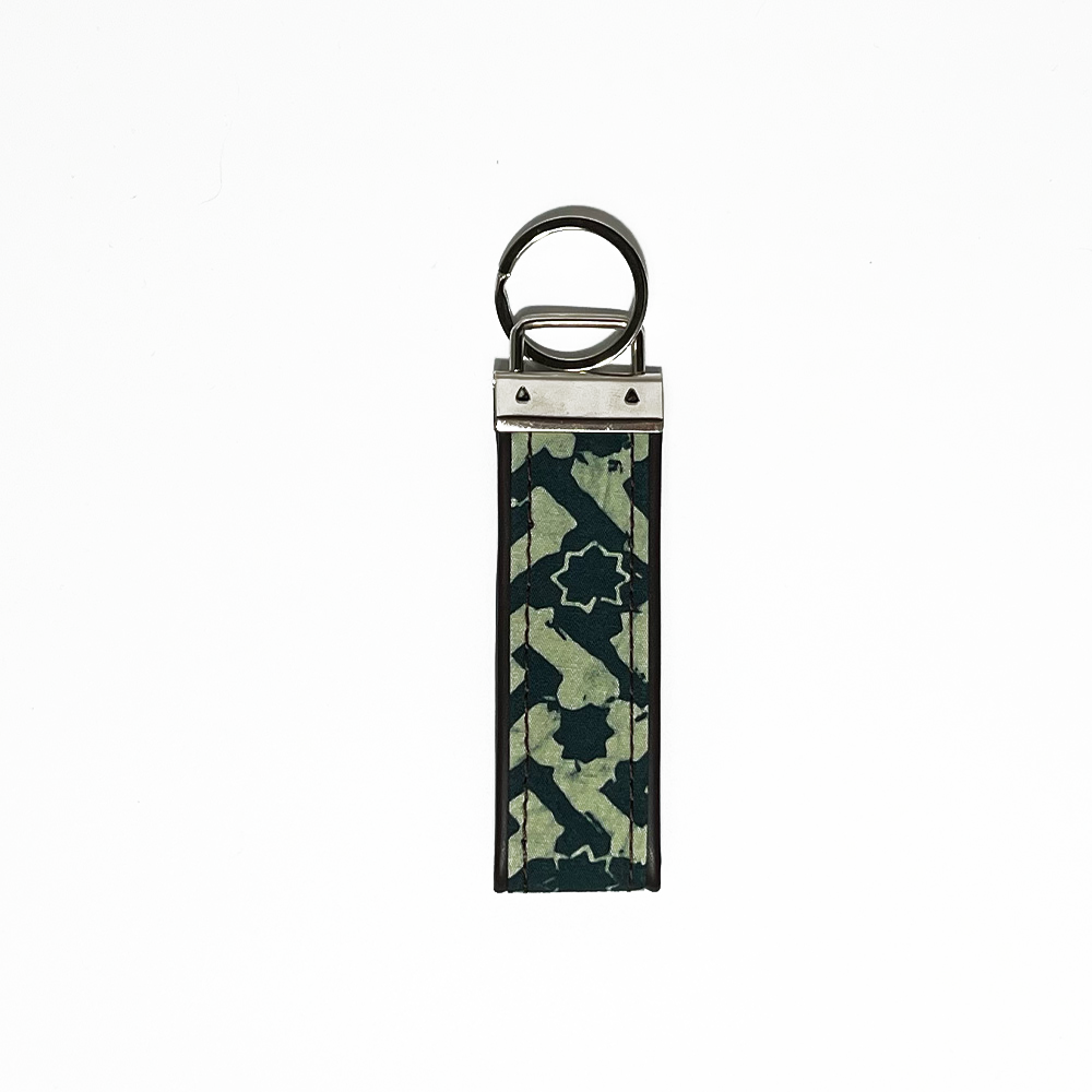 forest arabesque against a white background key fob