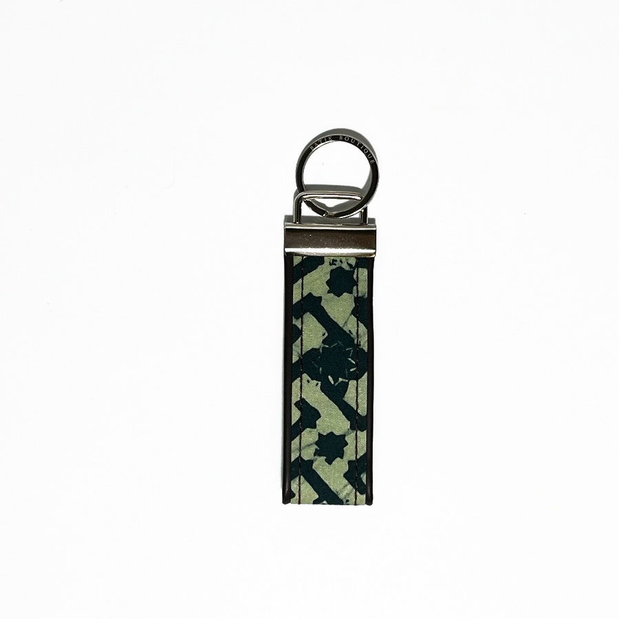 forest arabesque key fob against a white background