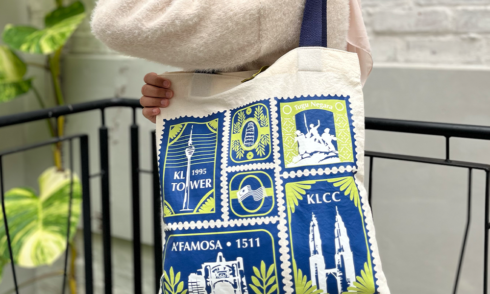 tote bags in the pattern limau setem with iconic malaysian landmarks stamp motifs