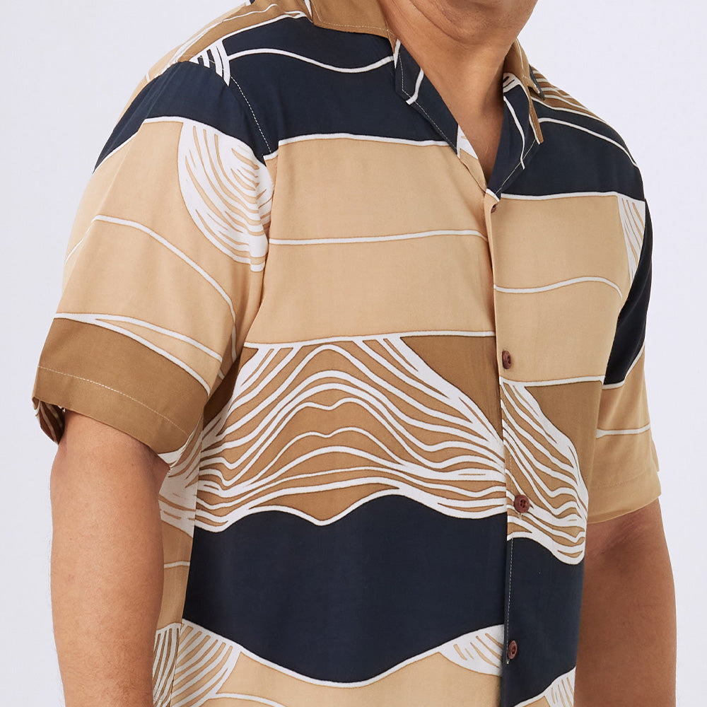 a close up photo of men shirt in black bukit pattern 