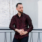 Lifestyle photo of the long sleeved batik shirt in Garnet Snake 