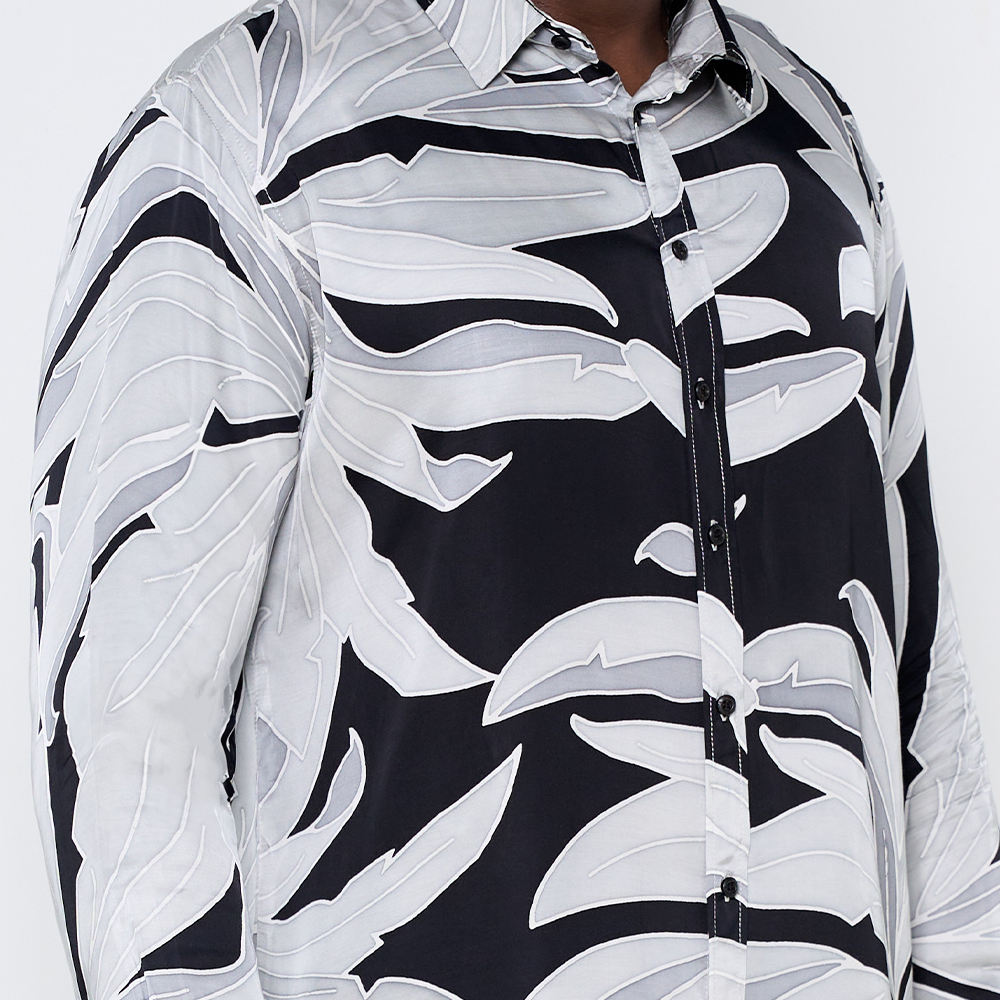 a closeup of the batik  pattern starry palma on a long sleeved shirt