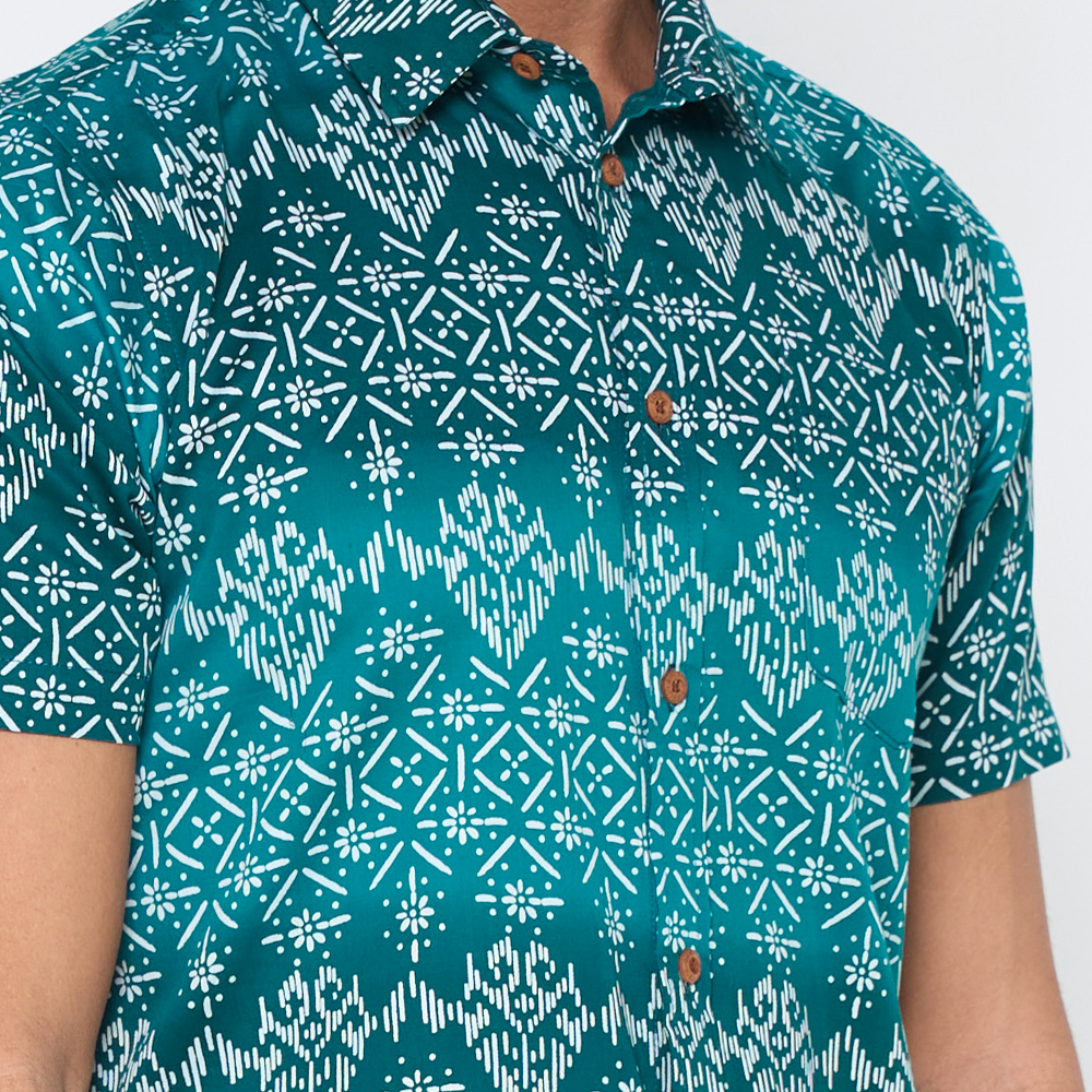 a closeup of batik shirt in the pattern turquoise anyam