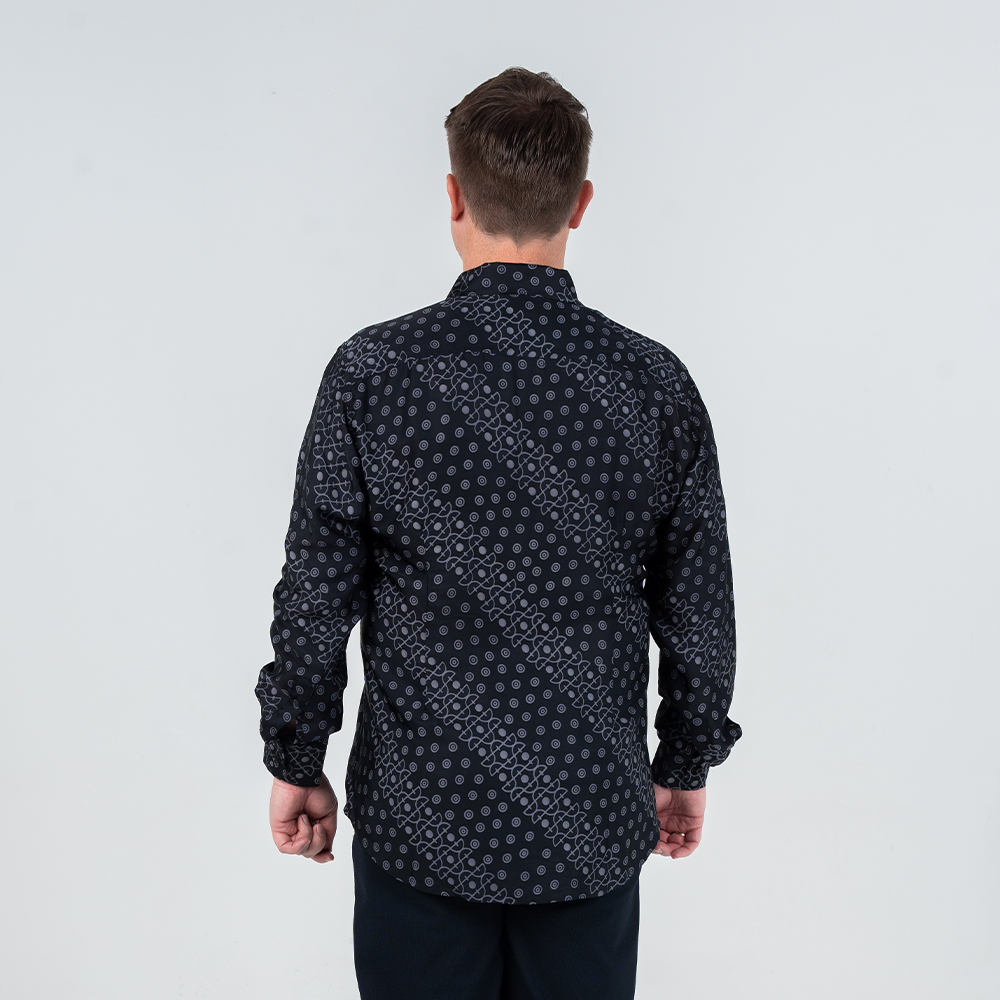 Back view of men's long-sleeved batik shirt in Jet Alur print, black with modern geometric batik motif.