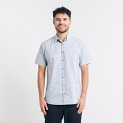  A full-body studio shot showcasing the modern fit of the Grey Anyam shirt, featuring darts at the back for a structured yet relaxed look