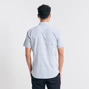 A rear view displaying the full batik pattern and tailoring details of the Grey Anyam shirt, ensuring a comfortable and stylish fit