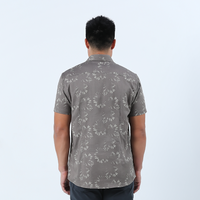 a man showcasing the back of batik shirt stone paw