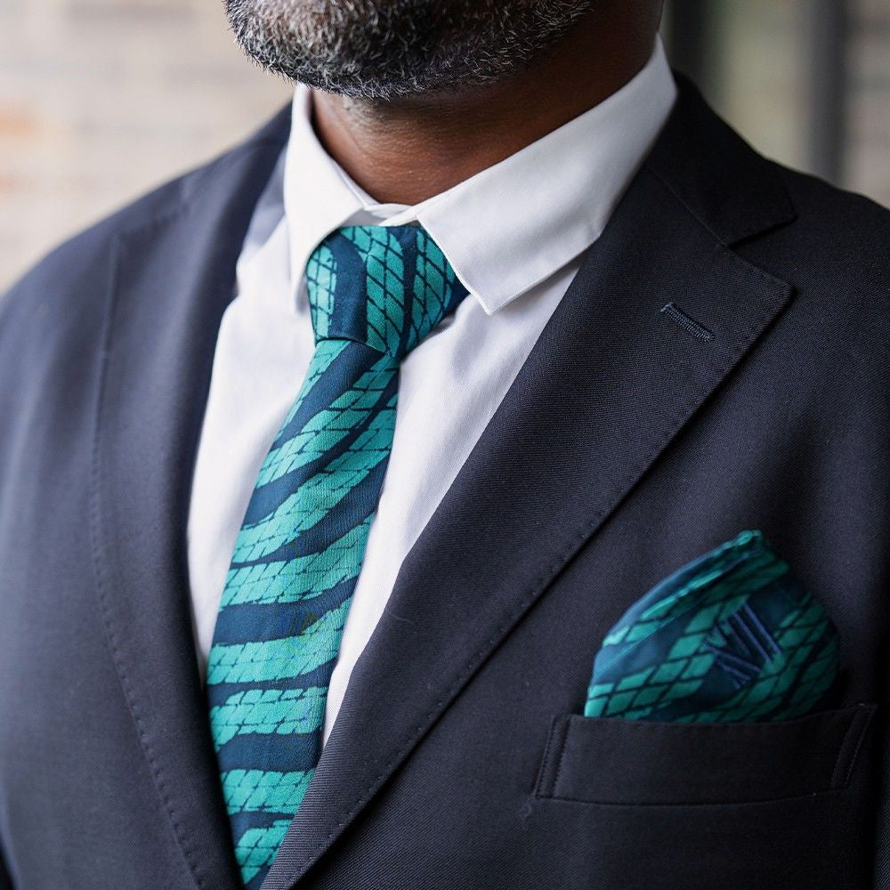 Batik Neck Tie & Pocket Square (Silk Cotton) - Teal Snakeskin show on a model with a suit jacket on 