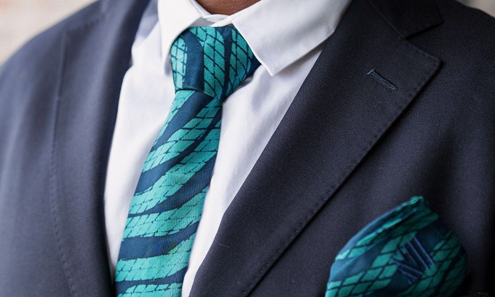 Batik Neck Tie & Pocket Square (Silk Cotton) - Teal Snakeskin show on a model with a suit jacket on 