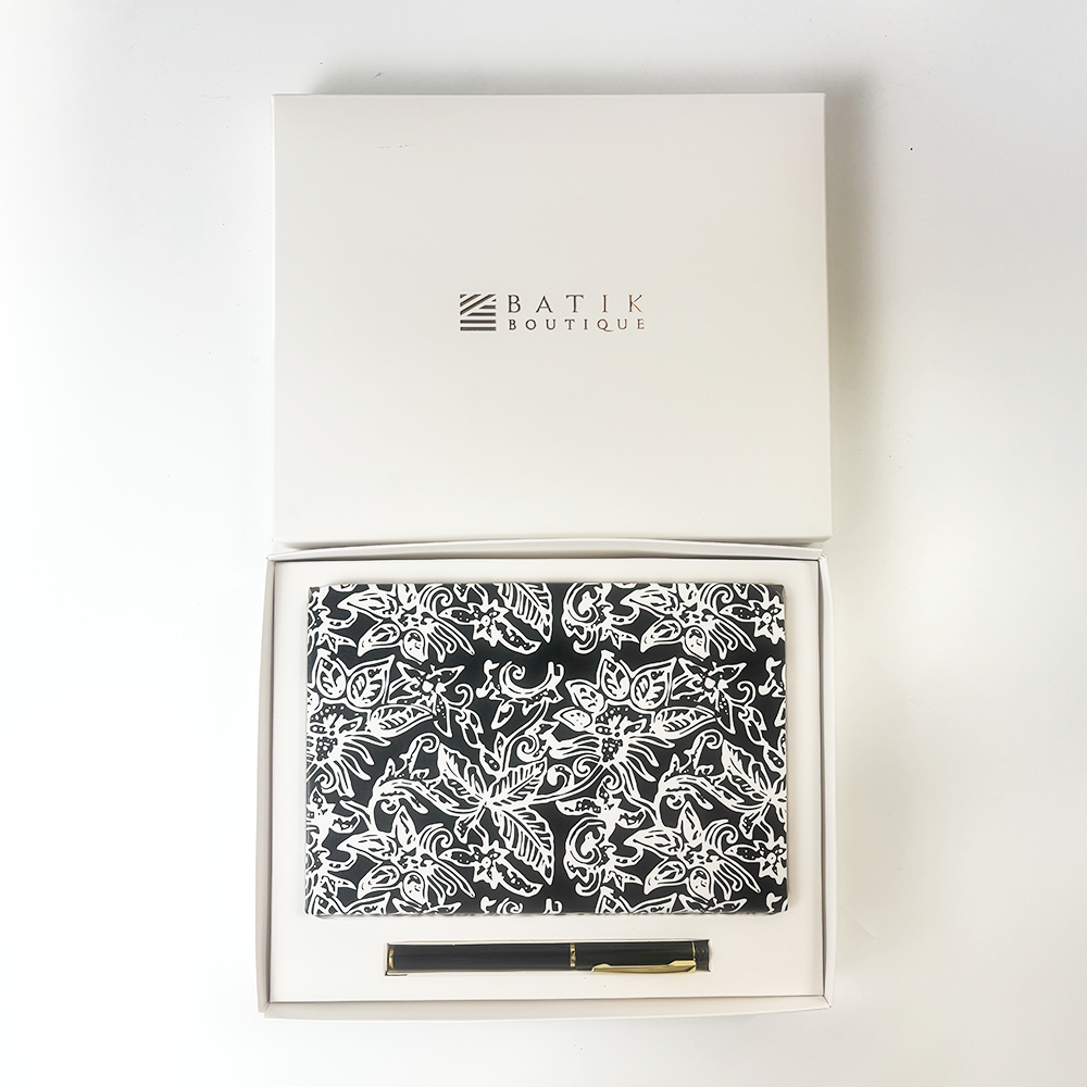 Batik Boutique gift set featuring black floral batik notebook and pen in white presentation box.