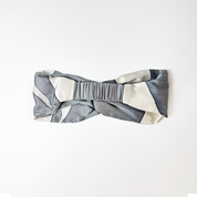 Front view of Silver Rose batik headband with hand-drawn floral batik design