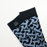 socks with embroidered closeup against a white background in the pattern midnight arabesque