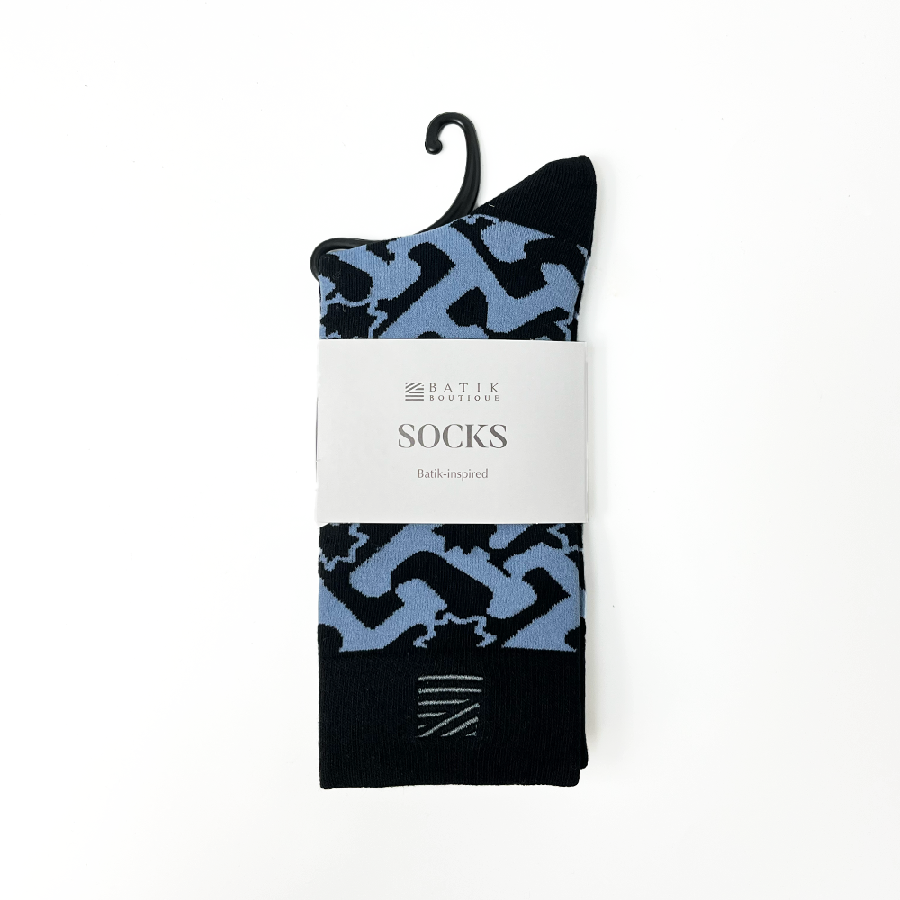 a batik inspired socks against a white background in the pattern midnight arabesque